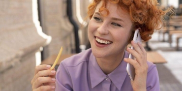close-up-smiley-woman-talking-phone-768x512