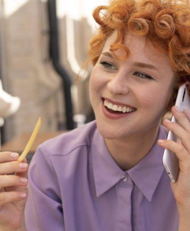 close-up-smiley-woman-talking-phone-768x512