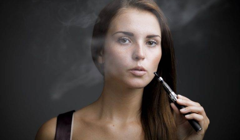 elegant-woman-smoking-e-cigarett-768x512
