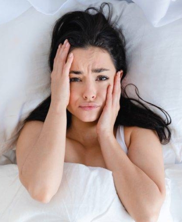 sad-young-caucasian-woman-lying-in-the-bed-with-wh-2023-11-27-04-59-23-utc-768x512