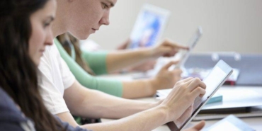 teenagers-using-digital-tablets-classroom-2022-03-07-23-55-55-utc-768x512